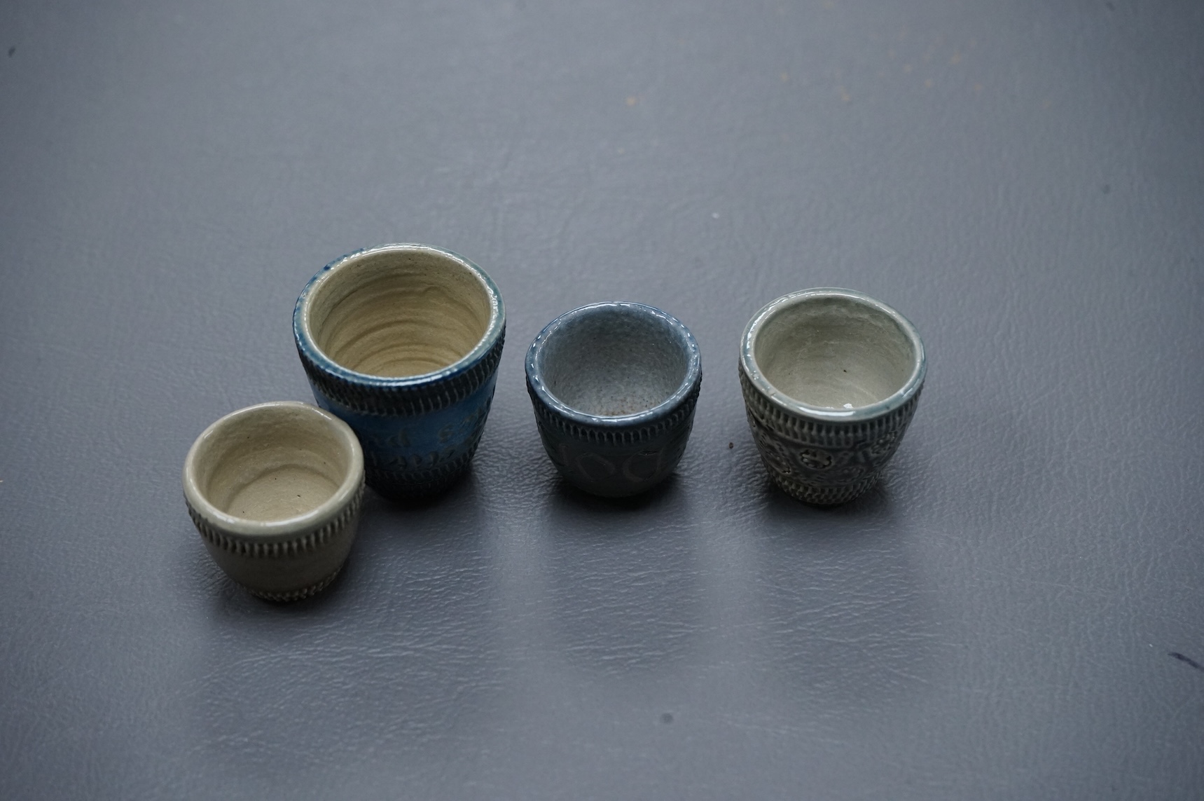 Guy Sydenham (1916-2005), four thimbles, made for the potter’s sister-in-law Doris, tallest 3cm